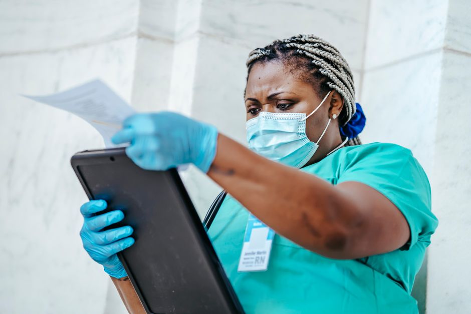 Nurse reviewing patient information on a tablet