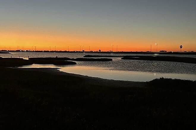 Sunset over a calm lake near Portland, Texas